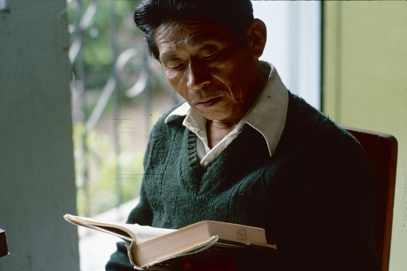 A Cakchiquel man reads a Bible